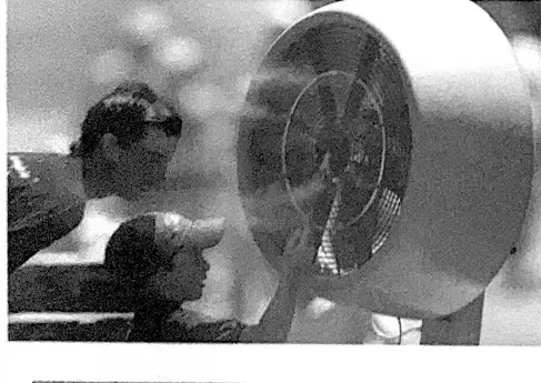 Outdoor cooling fan beside spectators